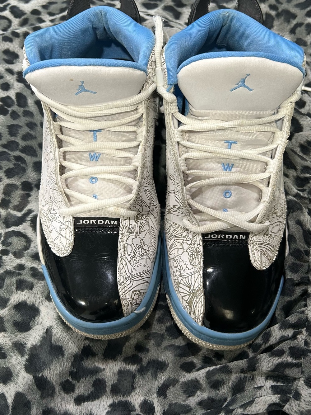 Jordan Women’s Low-Top Sneakers in White/Black/Light Blue